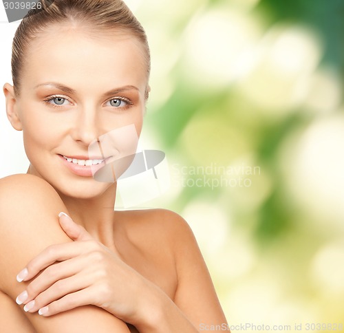 Image of beautiful young woman with bare shoulders