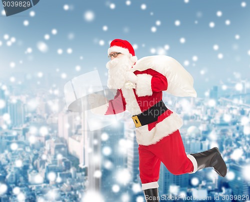 Image of man in costume of santa claus with bag