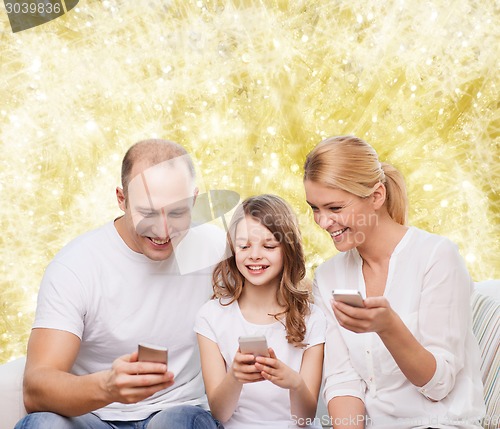 Image of happy family with smartphones
