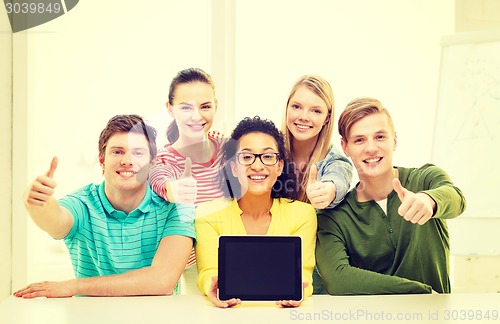 Image of smiling students showing tablet pc blank screen