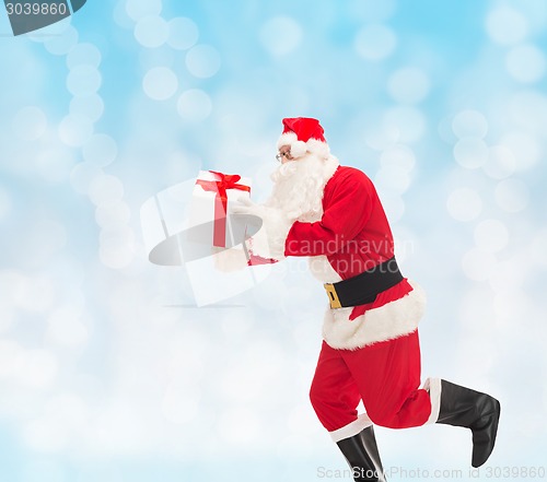 Image of man in costume of santa claus with gift box