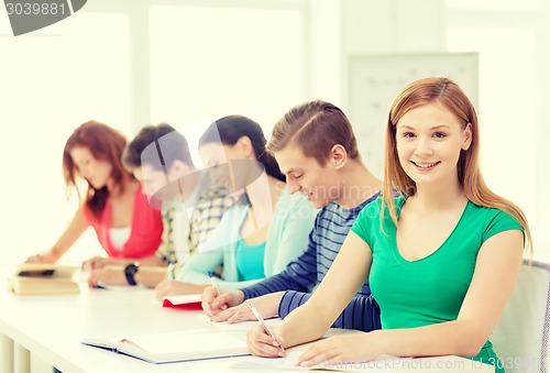 Image of students with textbooks and books at school