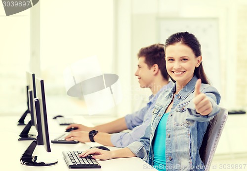 Image of two smiling students in computer class