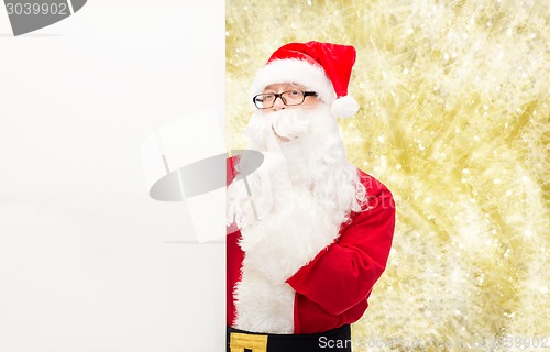 Image of man in costume of santa claus with billboard