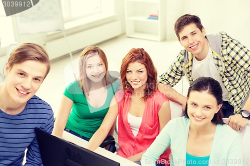 Image of group of smiling students having discussion