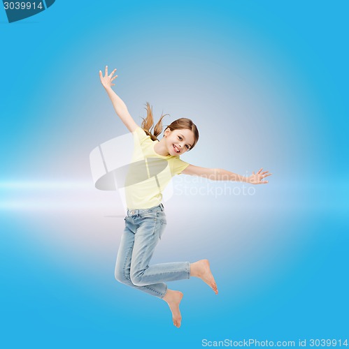 Image of smiling little girl jumping