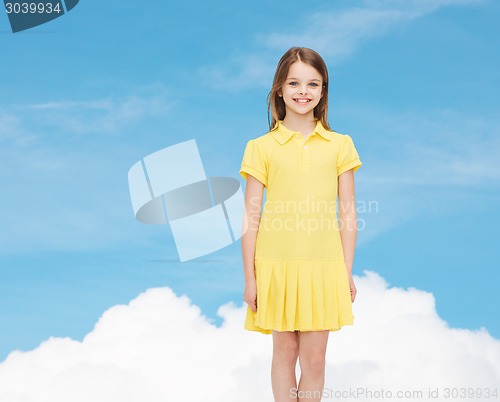 Image of smiling little girl in yellow dress
