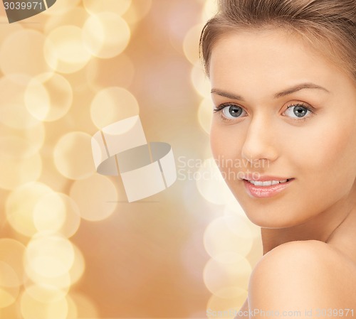 Image of beautiful young woman with bare shoulders