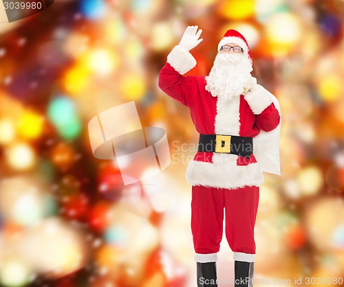 Image of man in costume of santa claus with bag