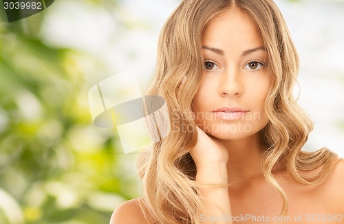 Image of beautiful young woman with bare shoulders