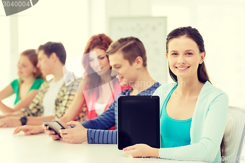 Image of smiling students with tablet pc at school