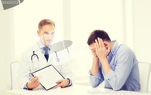 Image of doctor with clipboard and patient in hospital