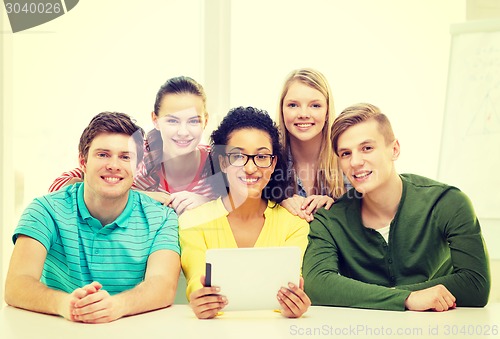 Image of smiling students with tablet pc computer at school