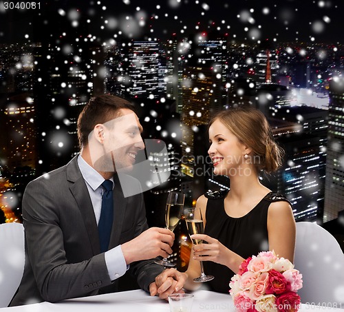 Image of smiling couple at restaurant
