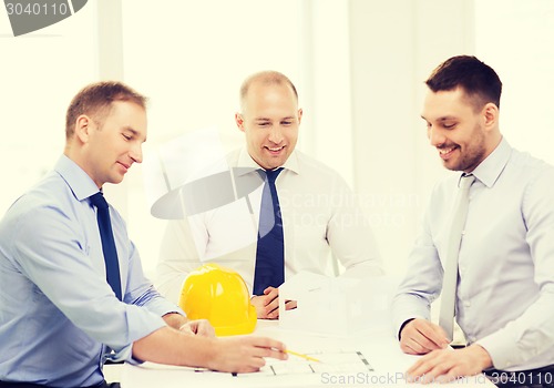 Image of happy team of architects and designers in office