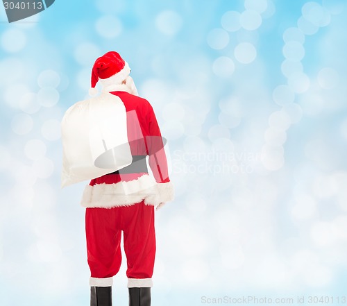 Image of man in costume of santa claus with bag