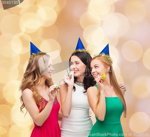 Image of smiling women holding glasses of sparkling wine