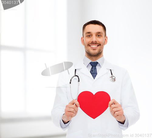 Image of smiling male doctor with red heart