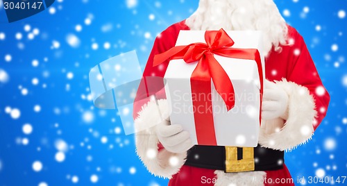 Image of man in costume of santa claus with gift box