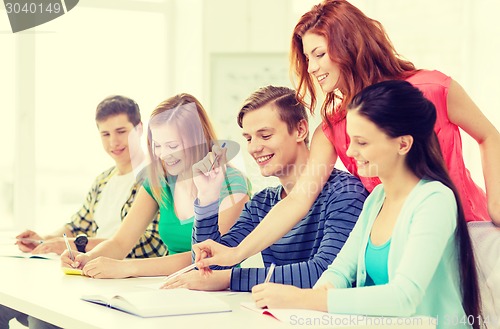 Image of students with textbooks and books at school