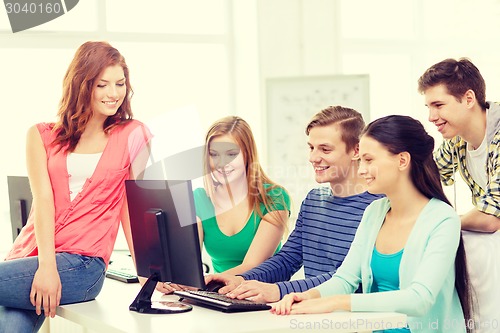 Image of group of smiling students having discussion