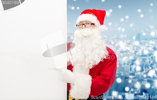 Image of man in costume of santa claus with billboard