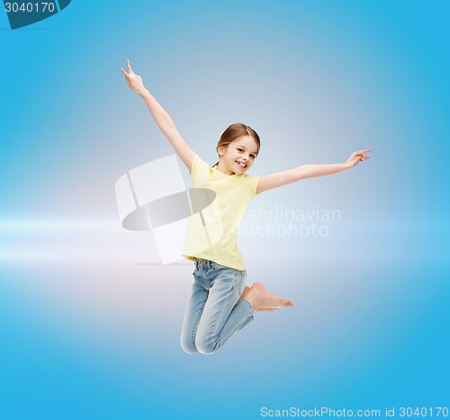 Image of smiling little girl jumping