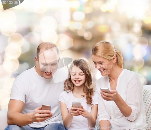 Image of happy family with smartphones