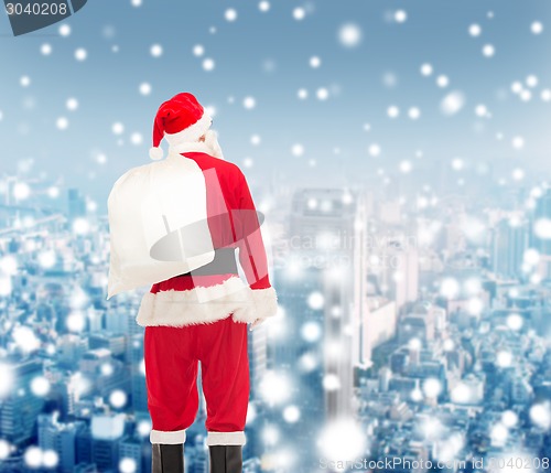 Image of man in costume of santa claus with bag