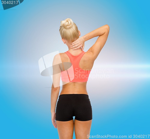 Image of sporty woman touching her neck
