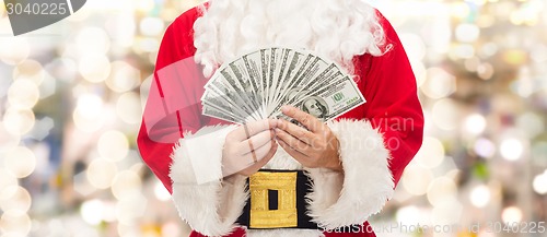 Image of close up of santa claus with dollar money