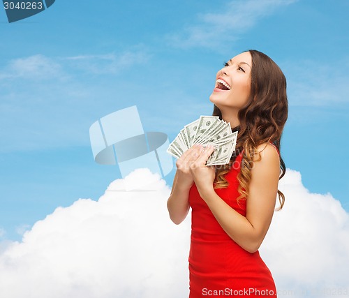 Image of woman in red dress with us dollar money