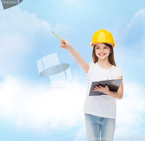 Image of smiling little girl in hardhat with clipboard