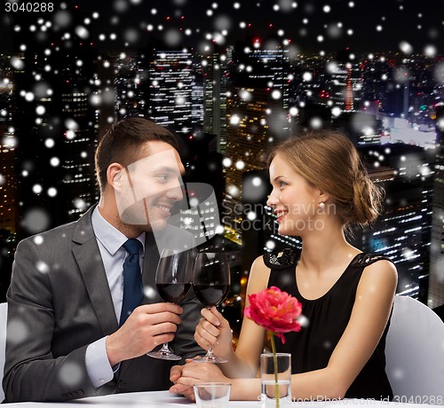 Image of smiling couple at restaurant