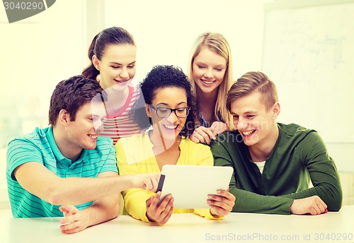 Image of smiling students with tablet pc computer at school