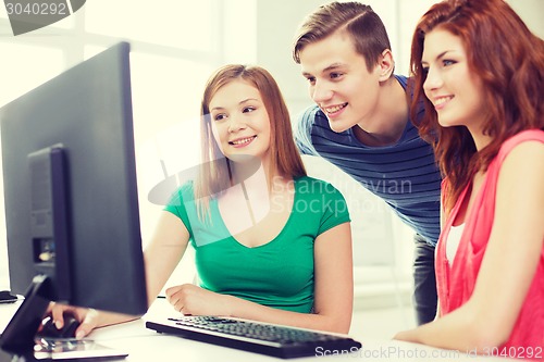 Image of group of smiling students having discussion