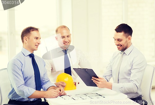 Image of happy team of architects and designers in office