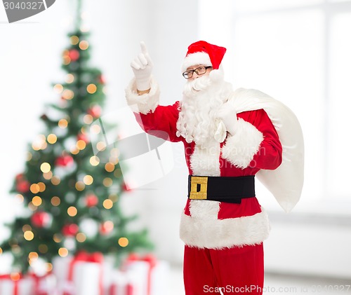 Image of man in costume of santa claus with bag