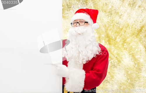 Image of man in costume of santa claus with billboard