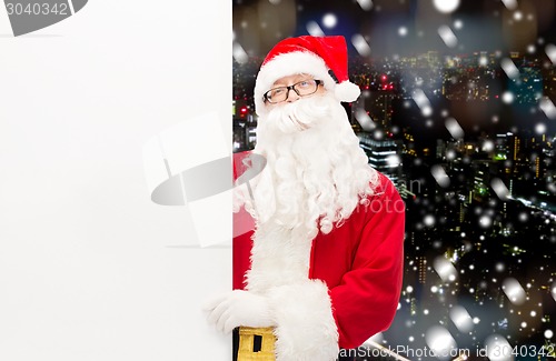 Image of man in costume of santa claus with billboard