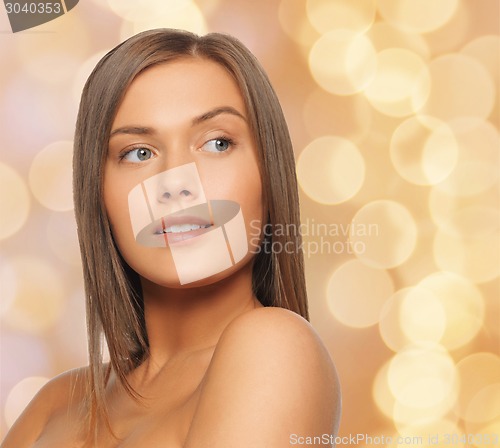 Image of beautiful young woman with bare shoulders