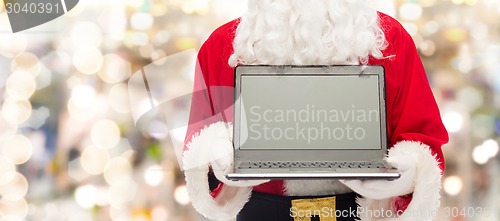 Image of close up of santa claus with laptop