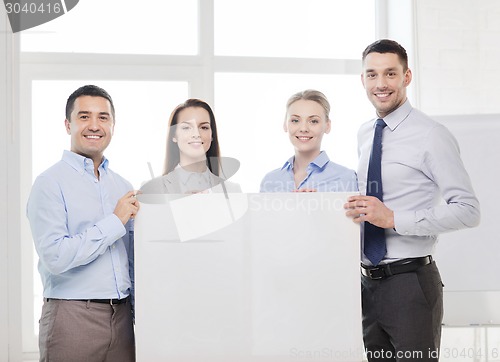 Image of business team in office with white blank board