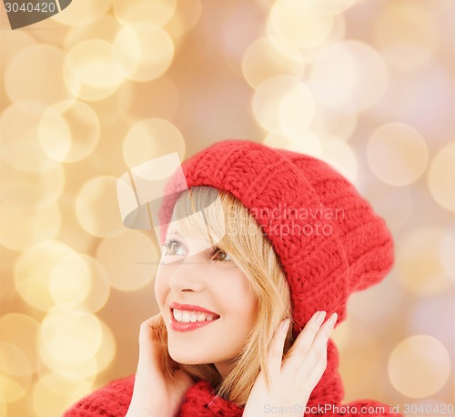 Image of smiling young woman in winter clothes