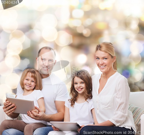 Image of happy family with tablet pc computers