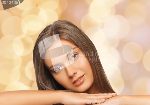 Image of beautiful young woman with bare shoulders