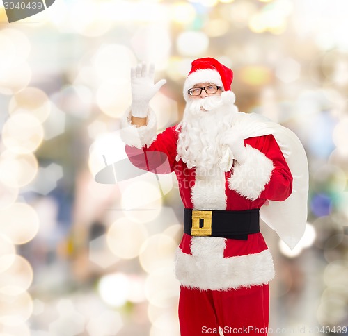 Image of man in costume of santa claus with bag