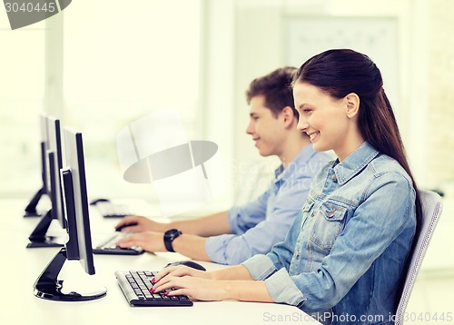Image of two smiling students in computer class