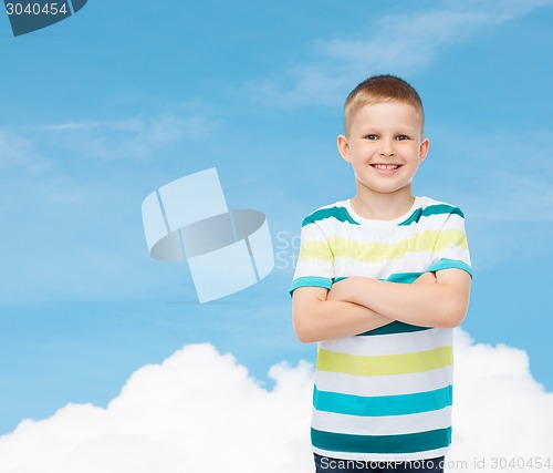 Image of little boy in casual clothes with arms crossed