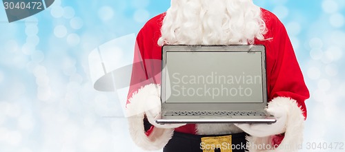 Image of close up of santa claus with laptop